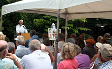 Cynthia speaking at Memorial Tribute to 
                      Phil Craig